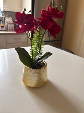 Vase with artificial flowers